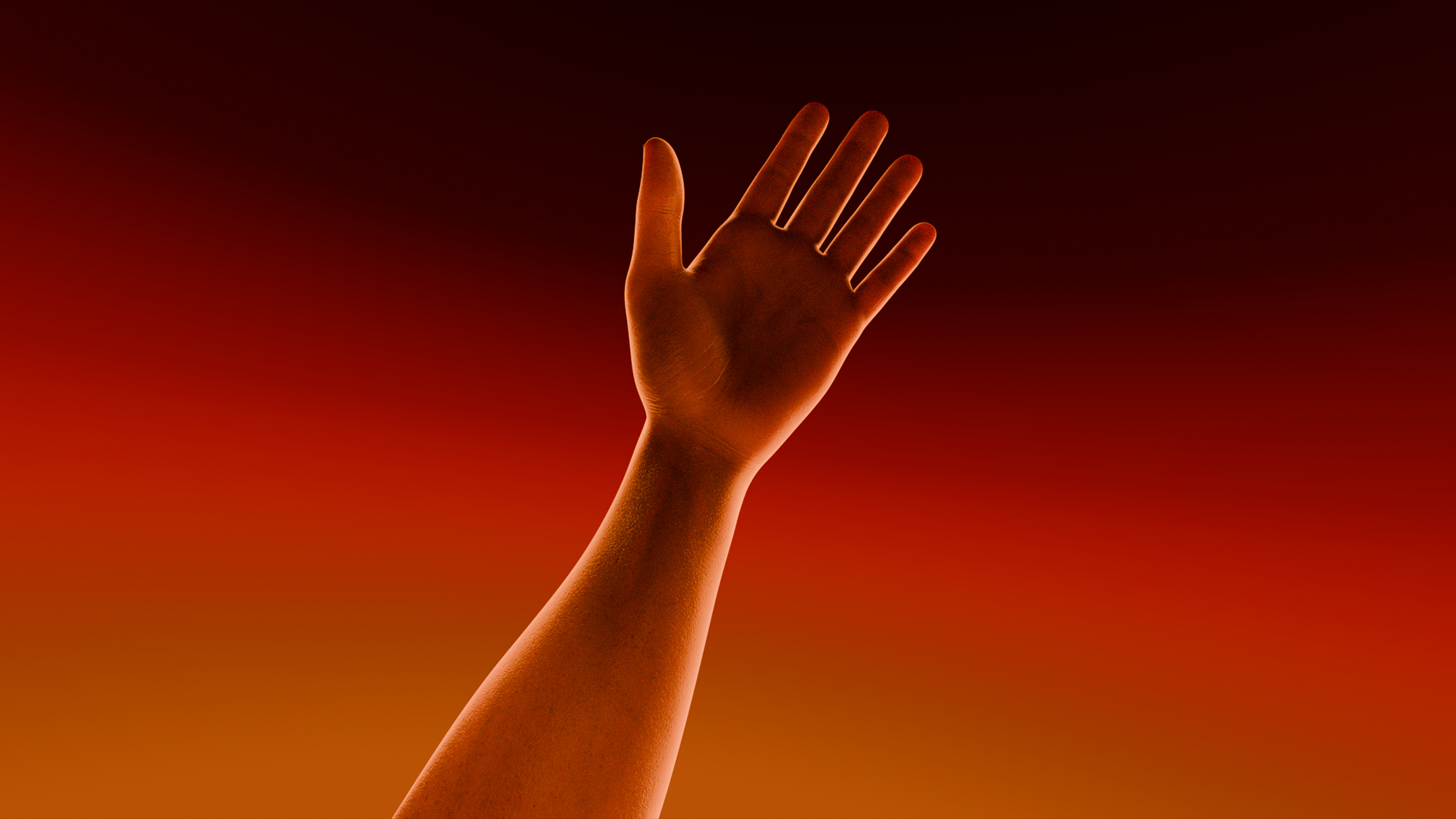 Open hand against an orange field